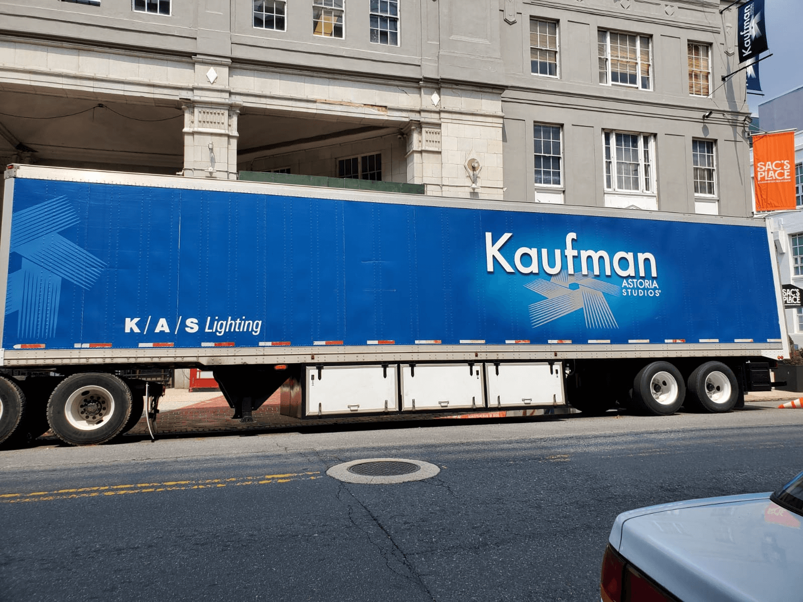 A truck parked on the street with the words Kaufman written on the side