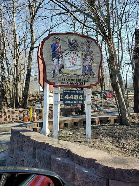 A sign on the side of a ride with a colonial and a Native American on it.
