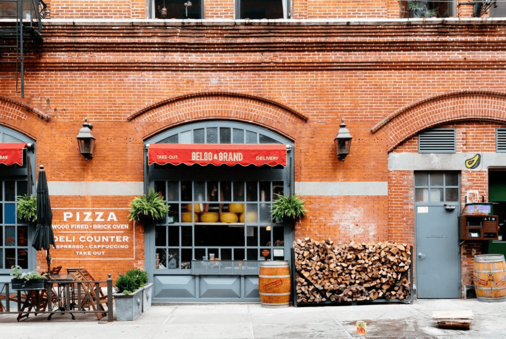A Pizza eatery in New York's Little Italy as seen from the street.