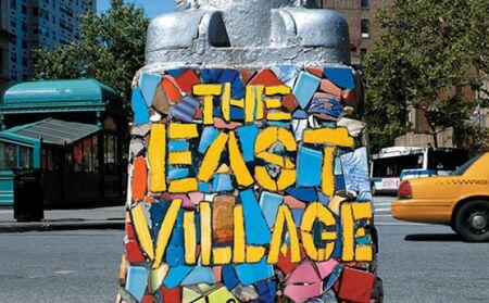 Lamp post Base with The East Village Painted on it.