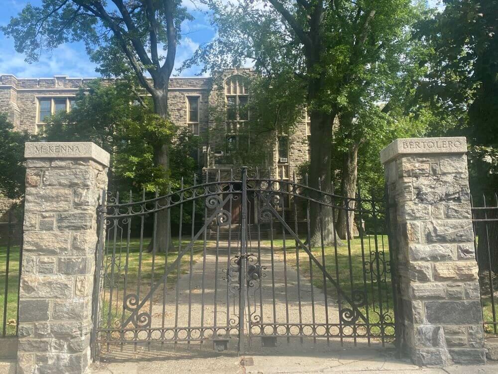 A gate on a gravel path at Fordham University
